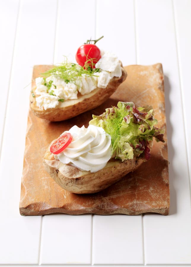 Baked potatoes with cheese stock image. Image of lunch - 18801845