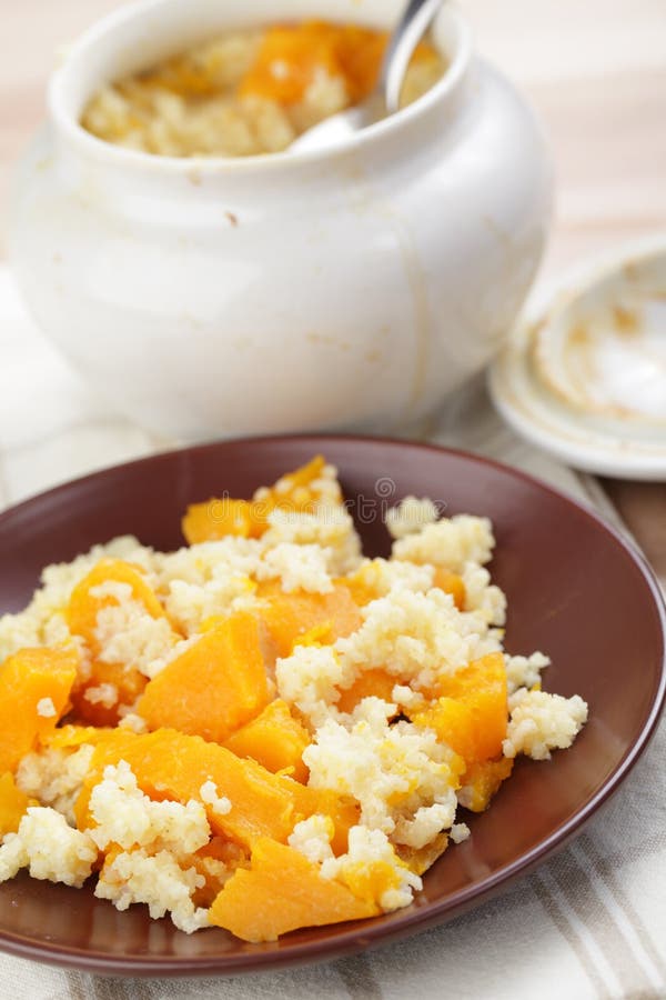 Baked pumpkin with millet stock photos