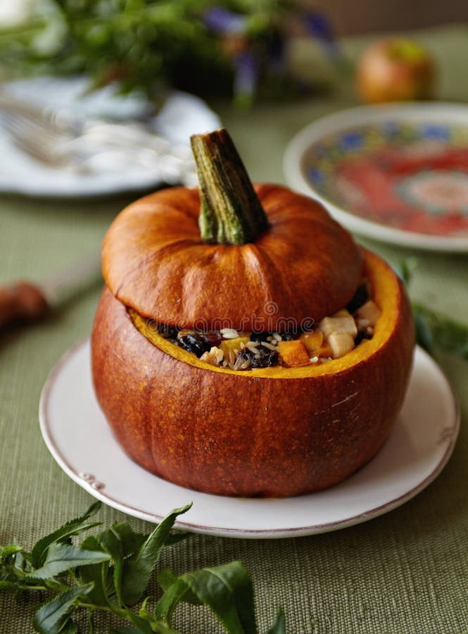 Baked Pumpkin with Rice and Fruits Stuffing royalty free stock photography