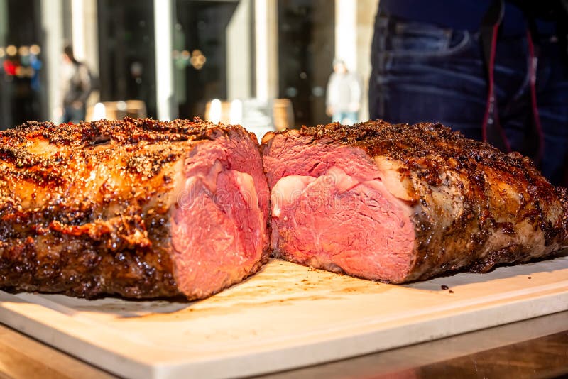 Baked Roast Beef from Rib Eye of Marbled Beef Lies on the Board Stock