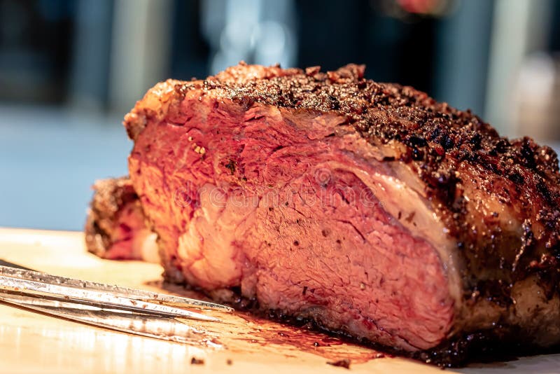 Baked Roast Beef from Rib Eye of Marbled Beef Lies on the Board Stock