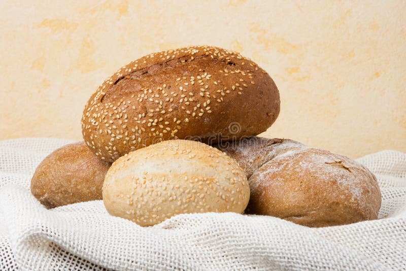 Baked rolls and bread on table