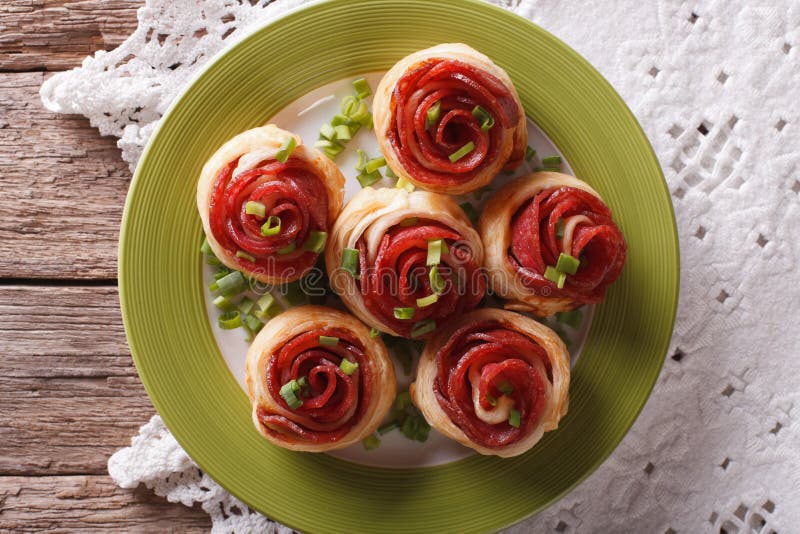 Baked Rolls with Salami in the Form of Roses Closeup. Horizontal Top