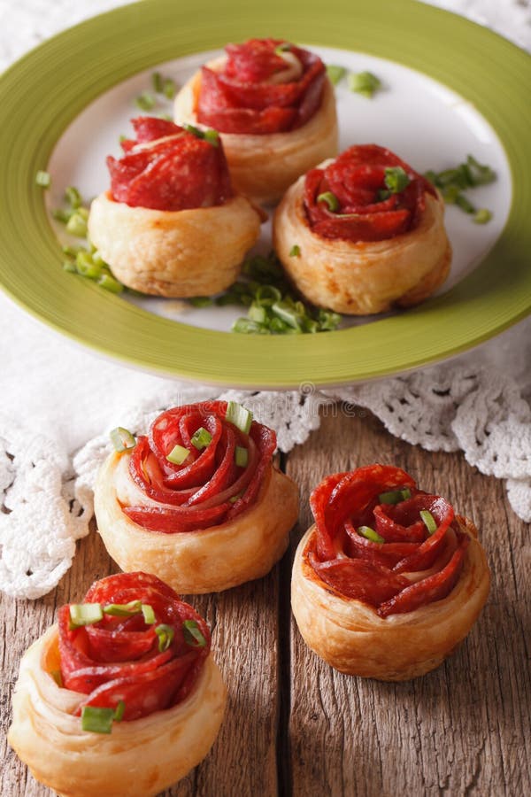 Baked Rolls with Salami in the Form of Roses. Vertical Stock Photo