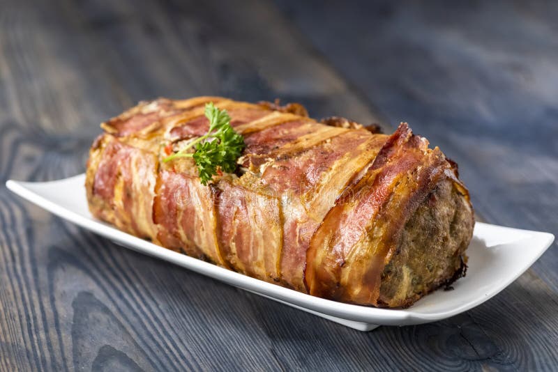 Baked roulade of minced meat surrounded by bacon