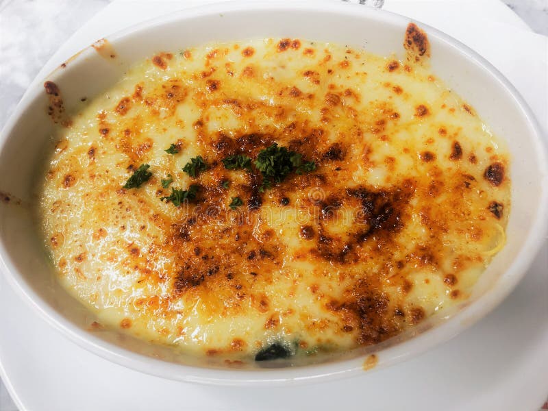 Baked Spinach with Cheese or Spinach Cheese Bake Stock Photo - Image of