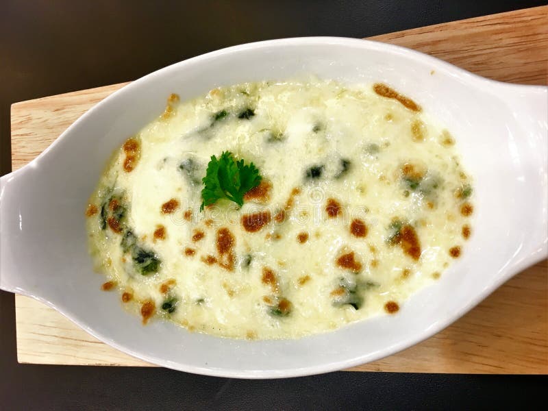 Baked Spinach with Cheese on Dish Italian Food Style. Stock Image