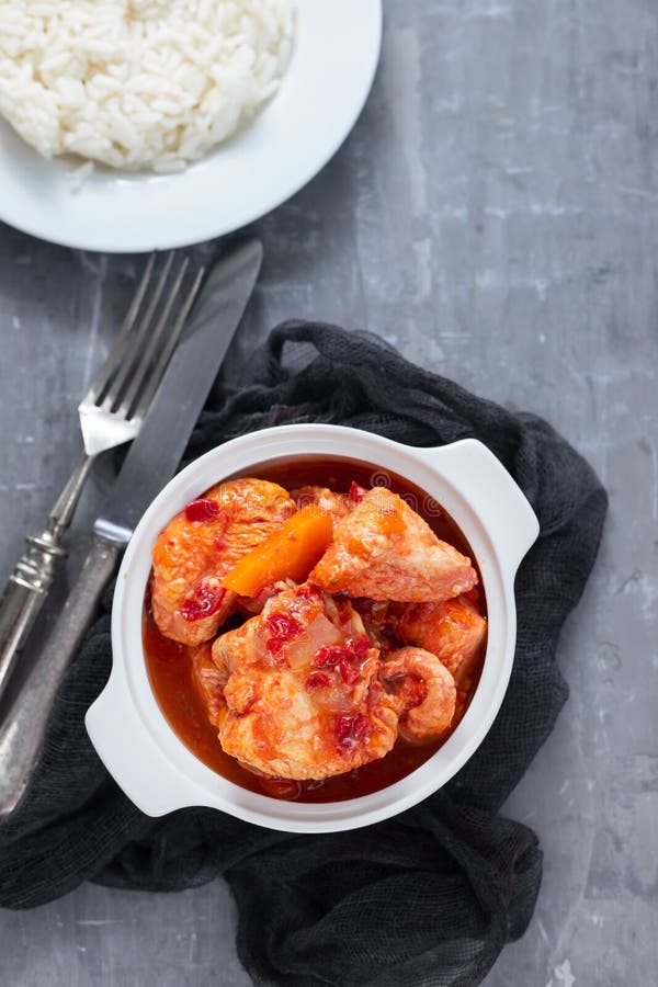 Baked Turkey Meat in White Bowl and Boiled Rice on White Plate Stock