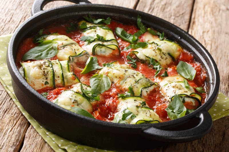 Baked Zucchini Rolls with Ricotta Cheese and Herbs in Tomato Sauce in a ...