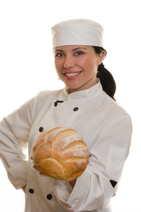 A smiling chef holding a loaf of bread. A smiling chef holding a loaf of bread.