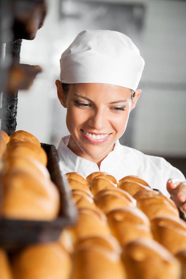Baker Looking at Fresh Breads in Bakery Stock Image Image of