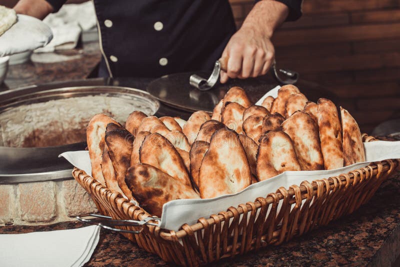 Baker Making Turkish Pita Bread in Tandoor, Clay Oven. Baking Process. Many  Fresh Hot Bread in the Basket. Stock Photo - Image of basket, bread:  133652622