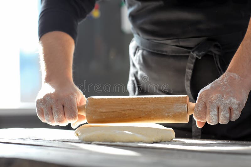 Baker is rolling a dough stock photo. Image of cooking 65132770