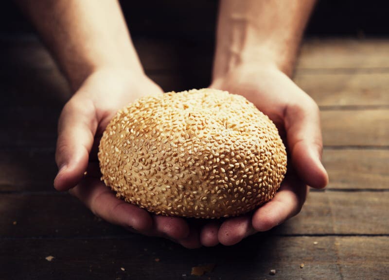 Baker s hands with a bread