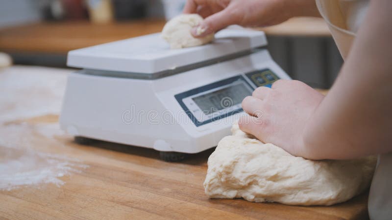 Baker Weighing Dough On Kitchen Scale Stock Photo 1646504854