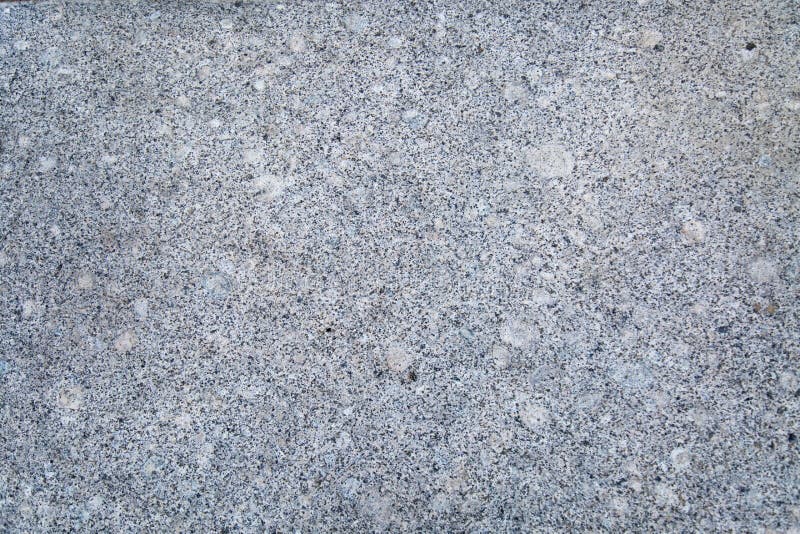 Bakgrund av vit rökig färg för polerad granit med lila svarta fläckar royaltyfri bild Bakgrund av vit rökig färg för polerad granit med lila svarta fläckar royaltyfri bild