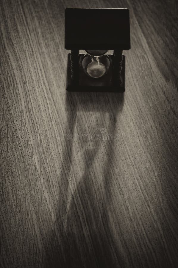 Bakgrund för timglasklockaskugga arkivfoton