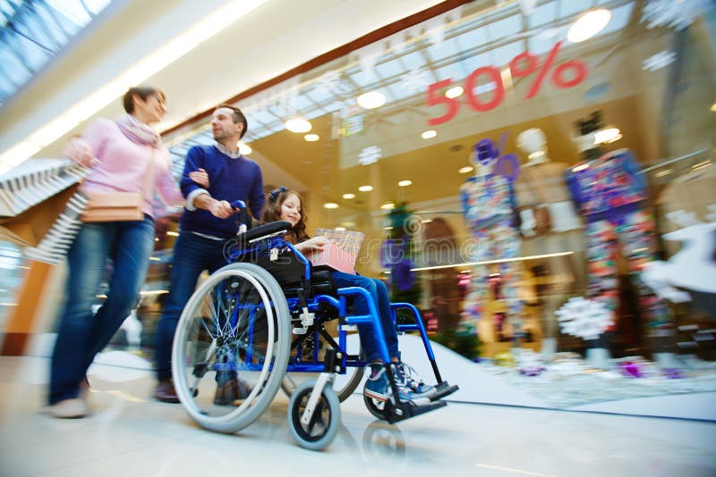 Family of three shopping together in the mall. Family of three shopping together in the mall