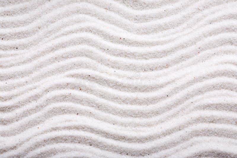 A background design in beautiful white sand. A background design in beautiful white sand