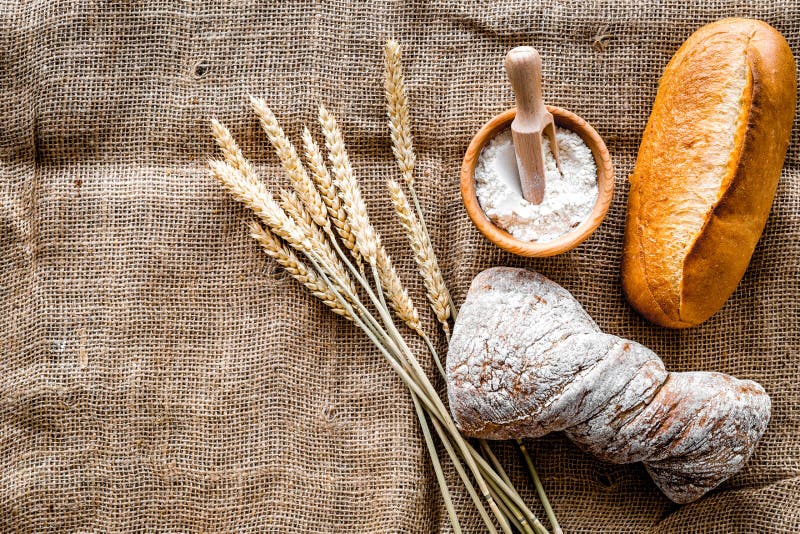 Download Baking Bread With Wheat Flour And Ears On Table Rystic Background Top View Mockup Stock Image ...