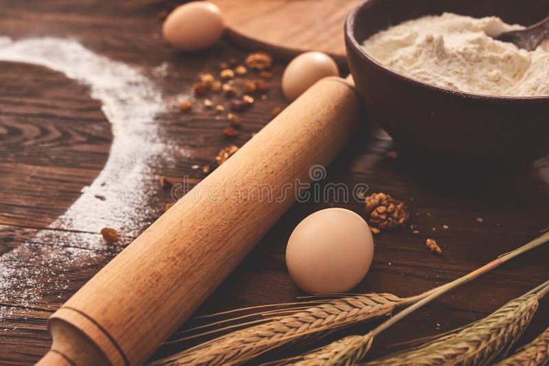 Baking chocolate cake in rural or rustic kitchen. Dough recipe ingredients on vintage wood table stock photos Baking chocolate cake in rural or rustic kitchen. Dough recipe ingredients on vintage wood table stock photos