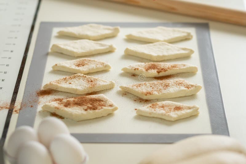 Baking Dough Blanks Sprinkled with Cinnamon on a Silicone Baking Mat