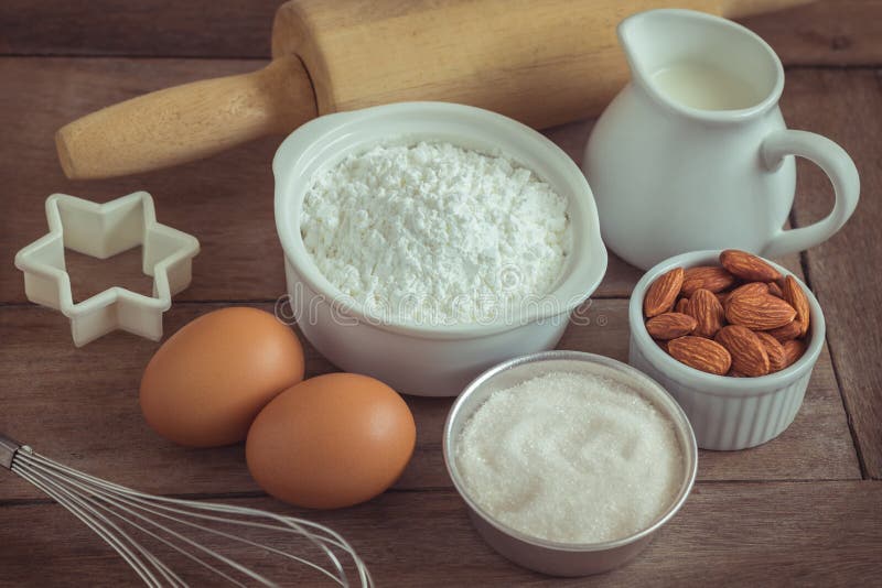Baking Ingredients Flour, Egg, Milk, Almonds, Oat Table Stock Photo