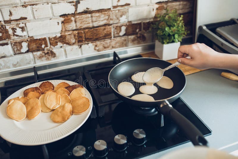 Baking Pancakes in Modern Kitchen. Steps of Making Cooking Pancake at