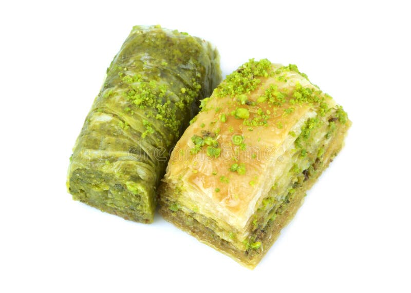 Delicious Turkish baklava and sarma with green pistachio nuts, isolated on white background. Delicious Turkish baklava and sarma with green pistachio nuts, isolated on white background