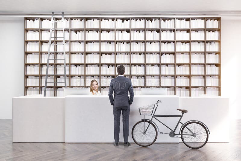 Man is standing in a library near a counter and talking to an employee. A bike is standing beside him. 3d rendering. Mock up. Man is standing in a library near a counter and talking to an employee. A bike is standing beside him. 3d rendering. Mock up