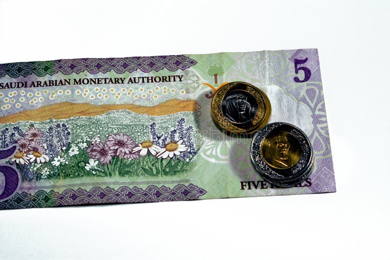 Baksidan av 5 sar fem saudi arabia riyals cash money-sedel 1438 ah har ett fält med blommor med 1 och 2 arkivbilder