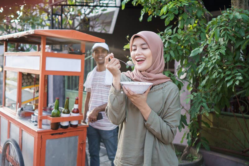 Bakso. indonesian famous meatball street food. asian woman enjoy eating bakso. Bakso. indonesian famous meatball street food. asian woman enjoy eating bakso