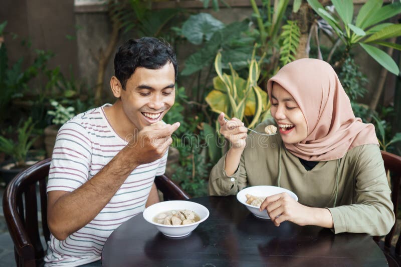 Bakso. indonesian famous meatball street food. asian women and men enjoy eating bakso. Bakso. indonesian famous meatball street food. asian women and men enjoy eating bakso