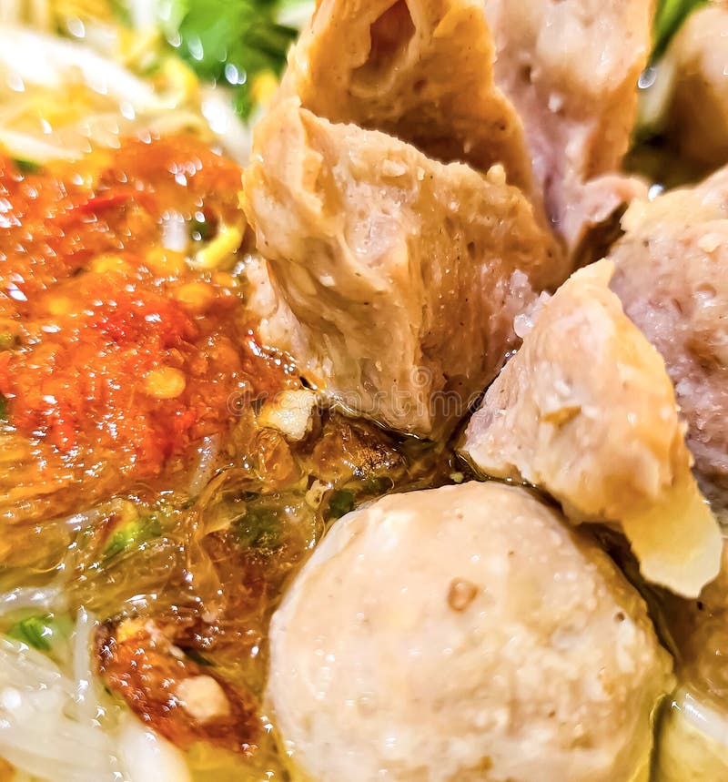 Bakso, indonesian meatball style served with beef broth soup and noodle springkled with fried onion and spring onion coupled with chili sauce on the top, very famous Asian street food