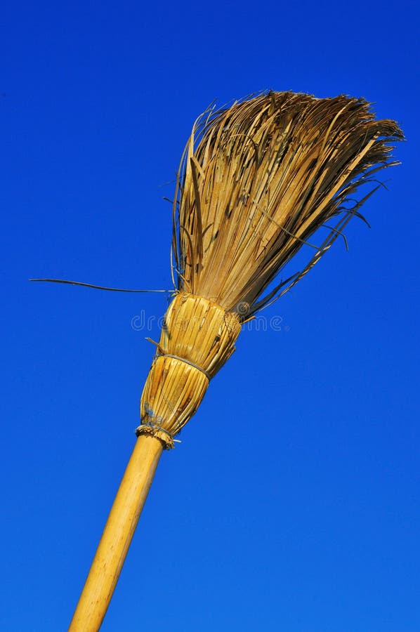 A rustic broom over the blue sky. A rustic broom over the blue sky