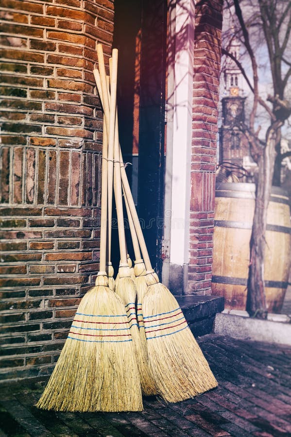 Traditional brooms outside of craft shop. Traditional brooms outside of craft shop