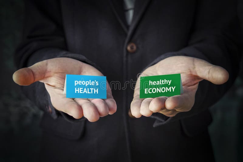 Balanced decision between human health or maintaining the economy during the covid-19 coronavirus pandemic. Economic crisis or. A balanced decision between human stock photos Balanced decision between human health or maintaining the economy during the covid-19 coronavirus pandemic. Economic crisis or. A balanced decision between human stock photos