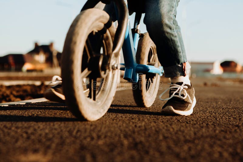 Balancing Bike Wheels and Child`s Feet Editorial Photography - Image of ...