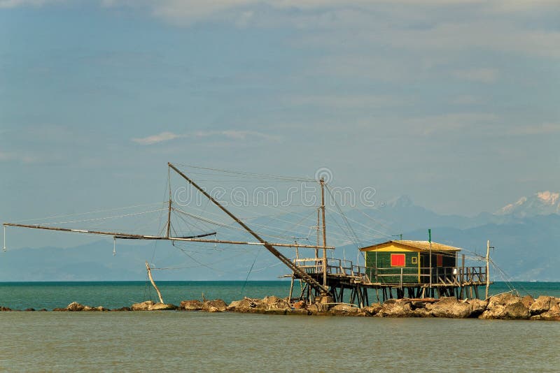Balancing fishing hut at the river mouth