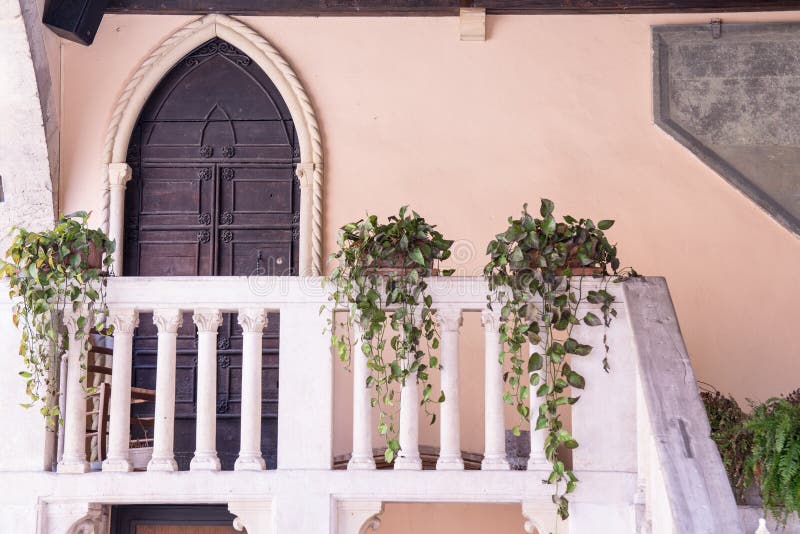 Balcony and front door minor of the medieval courthouse in Soave