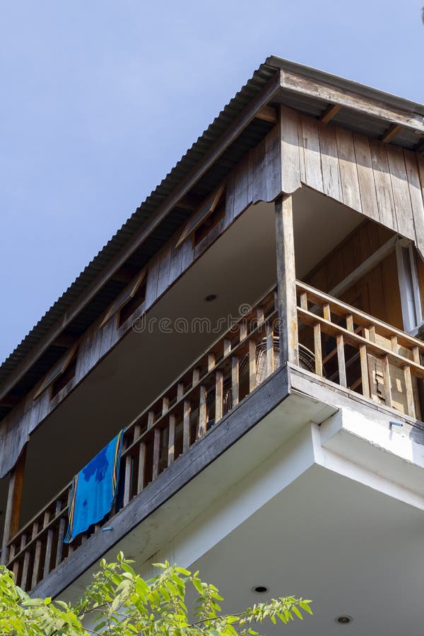 Balcony of native style cottage hotel in tropical island. Beach towel on rustic guesthouse balcony stock photography Balcony of native style cottage hotel in tropical island. Beach towel on rustic guesthouse balcony stock photography