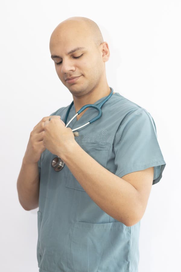 Bald Doctor with Medical Scrubs Stock Photo Image of background
