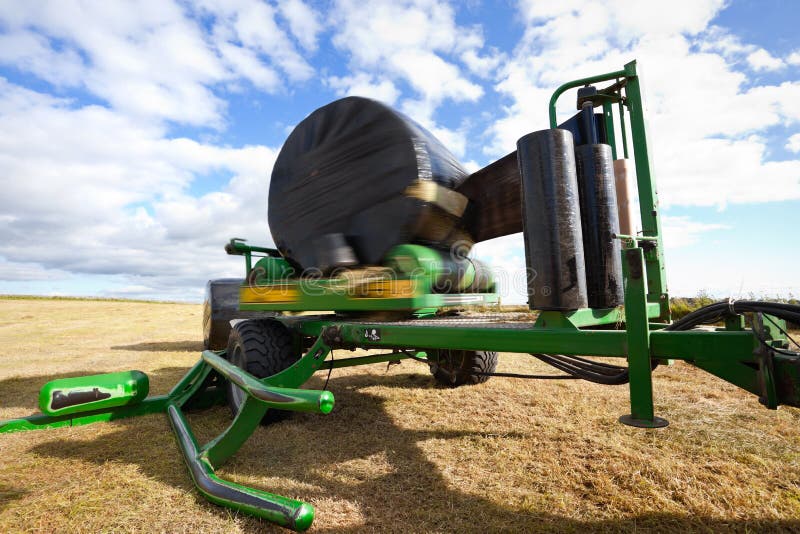 Bale of Hay Wrapping with Black Plastic Stock Image Image of blue