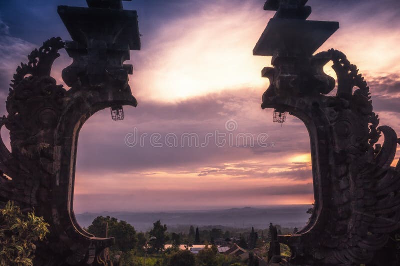 Bali Pura Besakih temple gates from high viewpoint on horizon during sunset as Bali travel lifestyle royalty free stock image