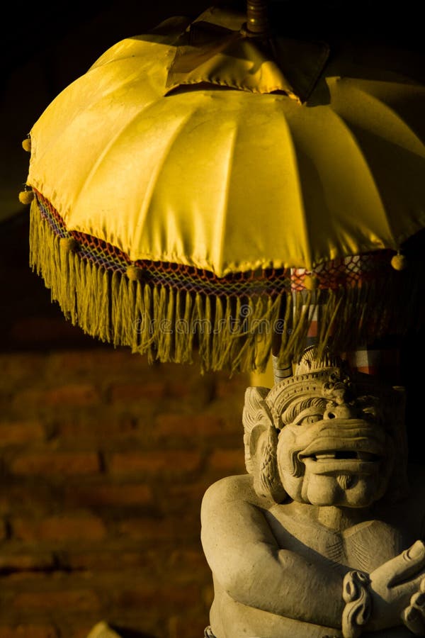 Balinese Statue Umbrella royalty free stock photography