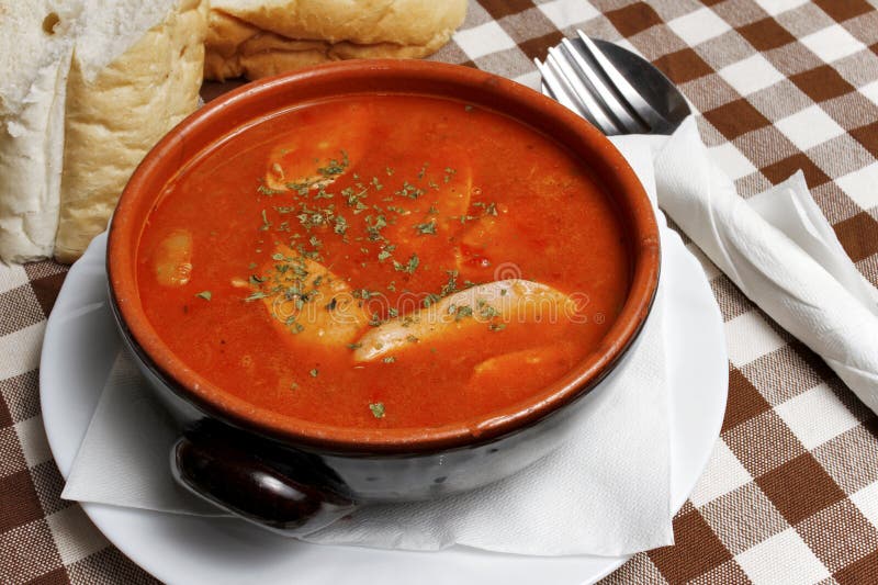 Balkan stew with sausage in a bowl with bread