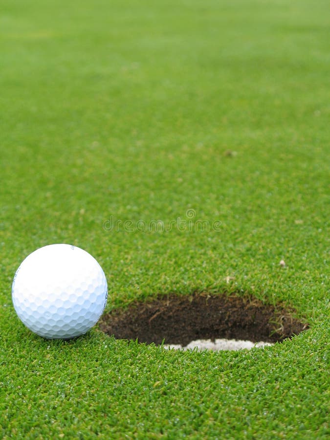 Ball beside hole