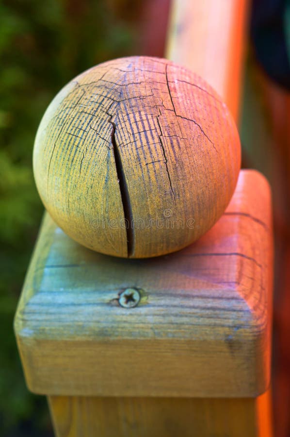 Ball with a crack of wood, the ball is made of solid wood, cracked wood bead, round tip stair railing royalty free stock images Ball with a crack of wood, the ball is made of solid wood, cracked wood bead, round tip stair railing royalty free stock images