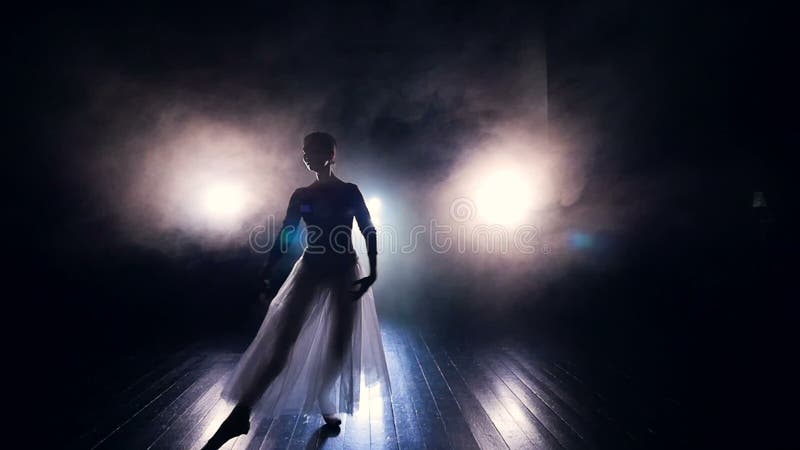 A ballerina walks to the camera in dancing movements.