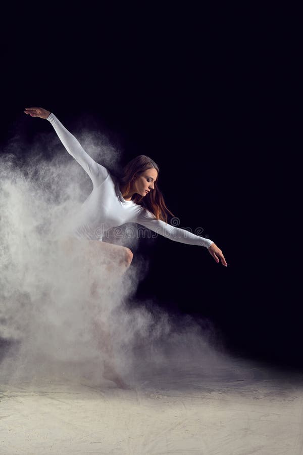 Ballerina dancing with flour on a black background royalty free stock photo Ballerina dancing with flour on a black background royalty free stock photo